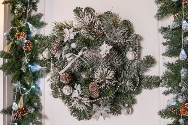 Get Your New Entryway Today! 2 Christmas wreath with pine cones Premium Photo