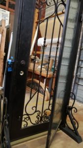 Consider an Iron Door for Your Home 1 Iron door with open glass window